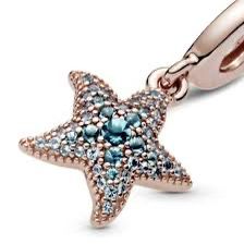 charm p rose estrella con piedras azules