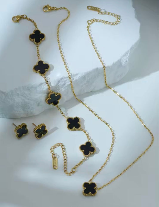 Juego vc aretes collar y brazalete negro y dorado